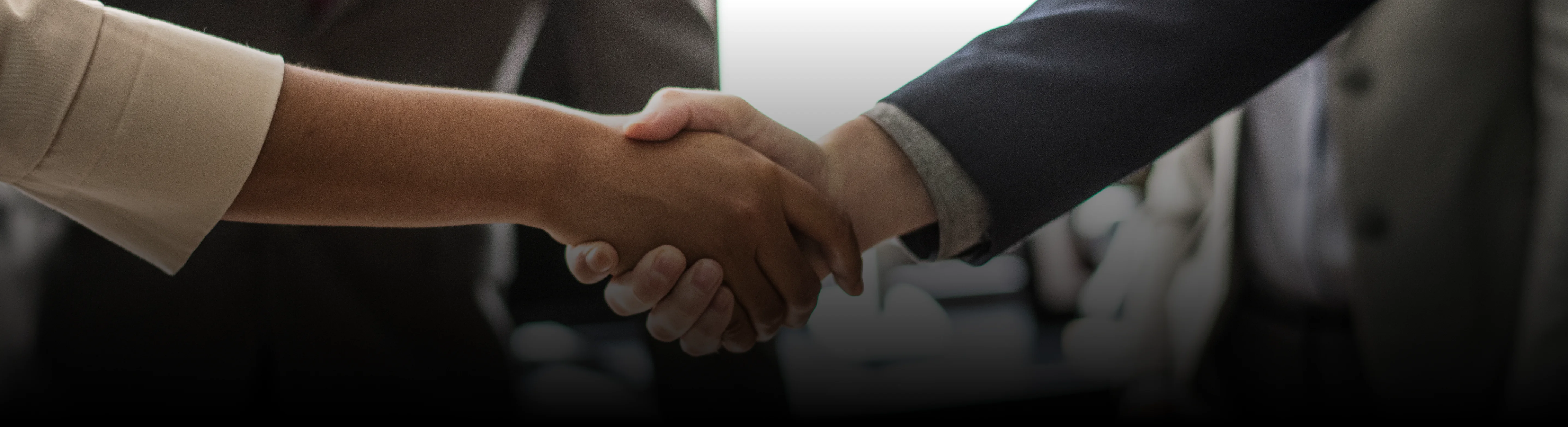 Kundan Cab clients banner with handshake representing trusted partnerships